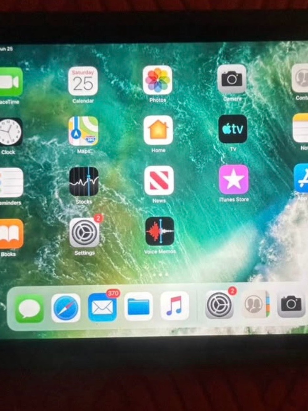 Apple iPad Tablet - Black Front Display with Green Wallpaper